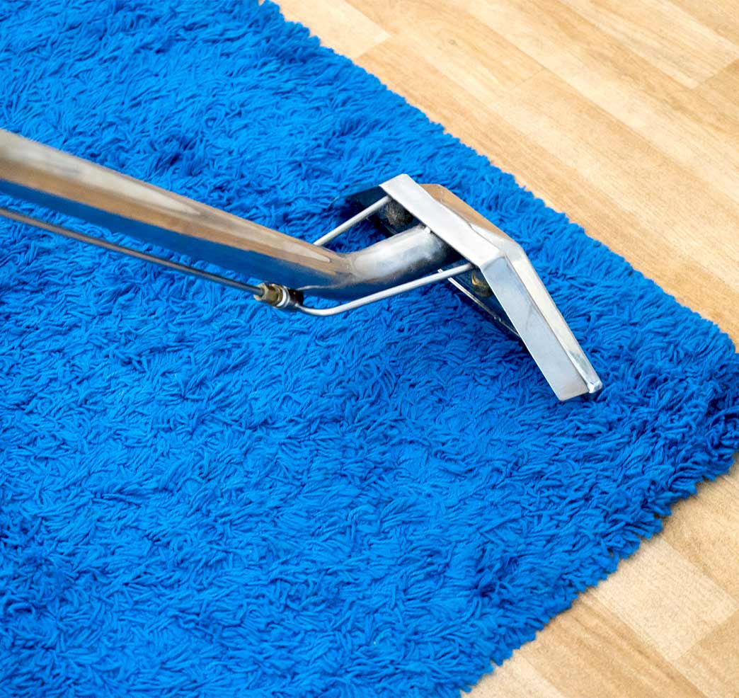blue-carpet-being-cleaned