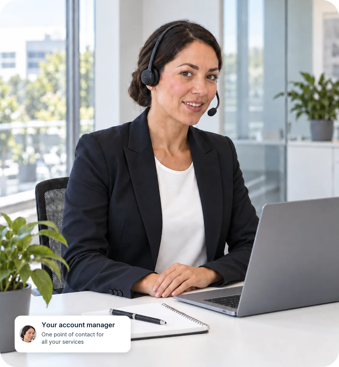 Fantastic Services account manager on a call at her desk